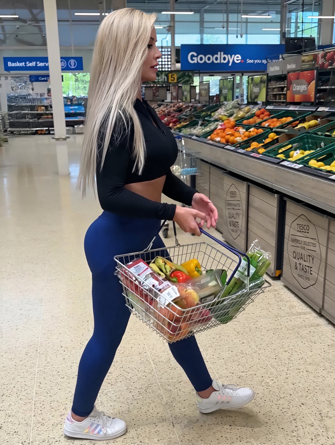 Miss Sally with her shopping basket by the fresh produce